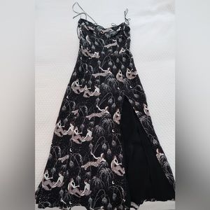 Reformation dress. Print is of a woman pouring champagne, leg slit, size 0.